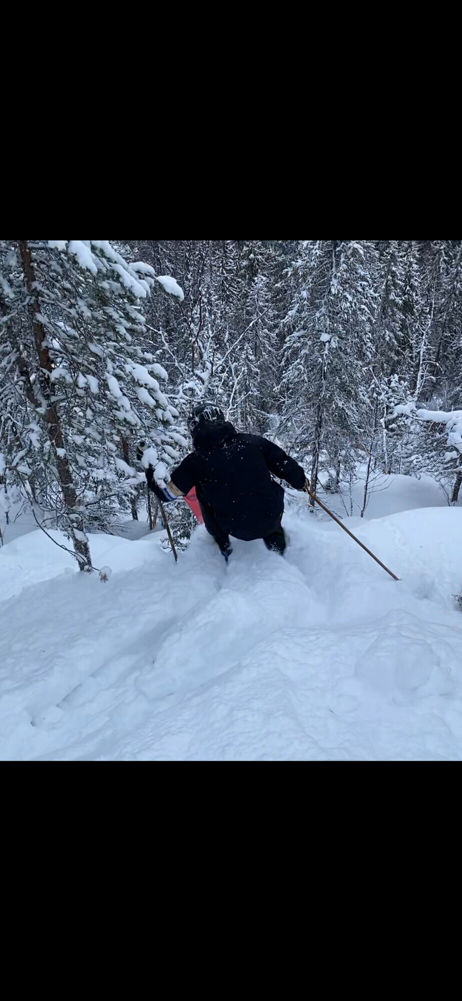 Klutmarksbacken in Sweden - a person skiing down a hill in the snow.