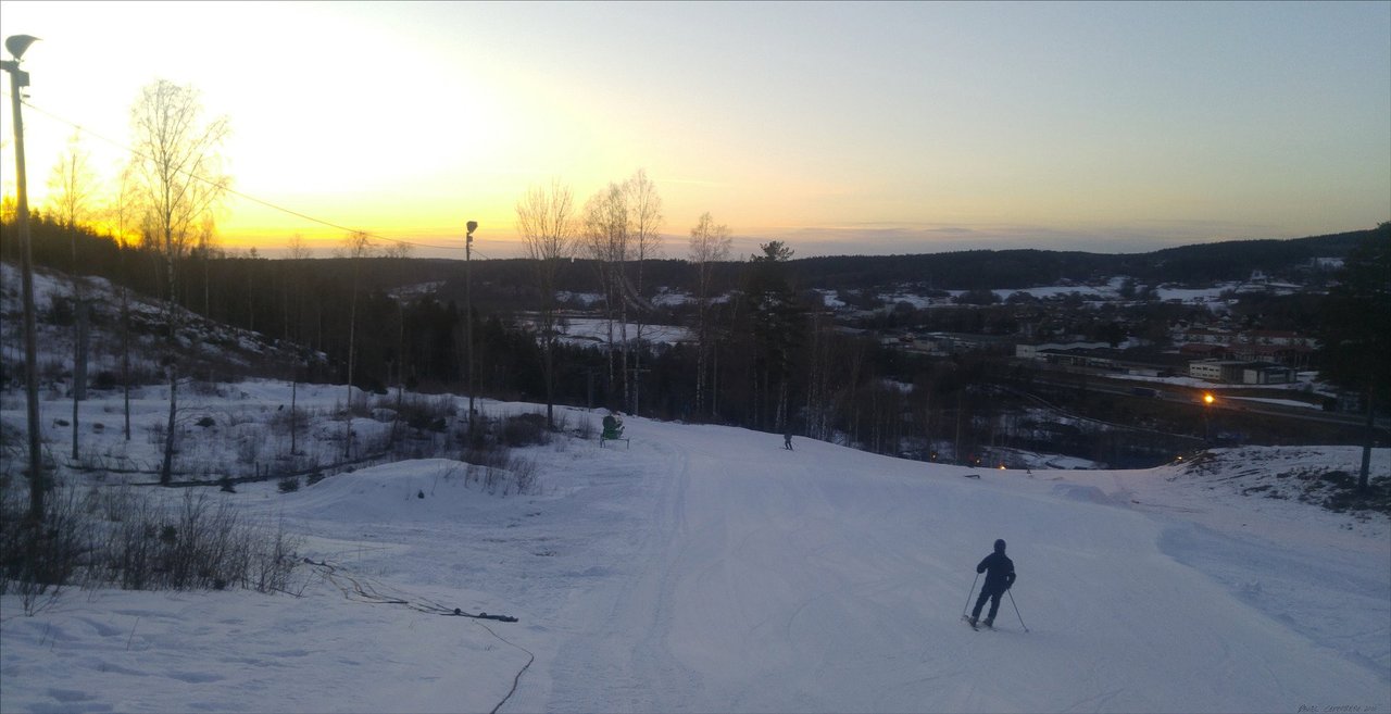 Bollekollen – Bollebygd in Sweden - a person skiing down a hill at sunset.