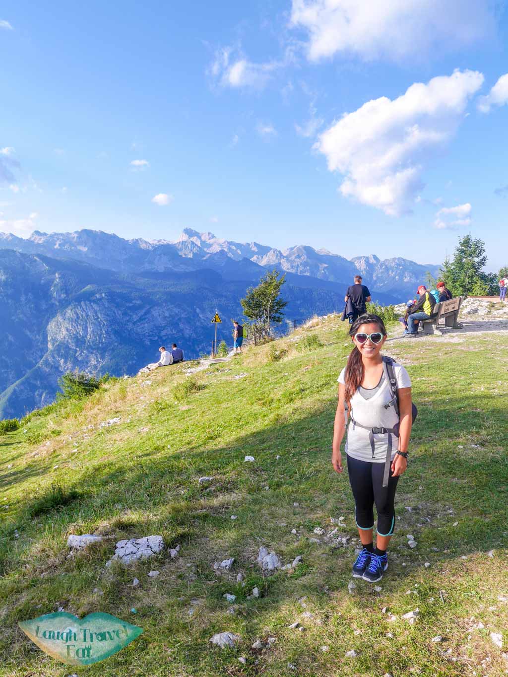 Vogel in Slovenia - a woman standing on top of a mountain.