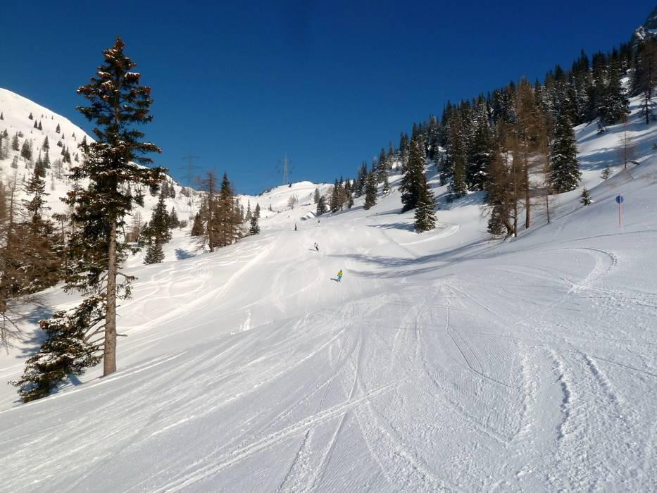 Marienbergbahnen Biberwier in Austria - a person skiing down a slope in the mountains.