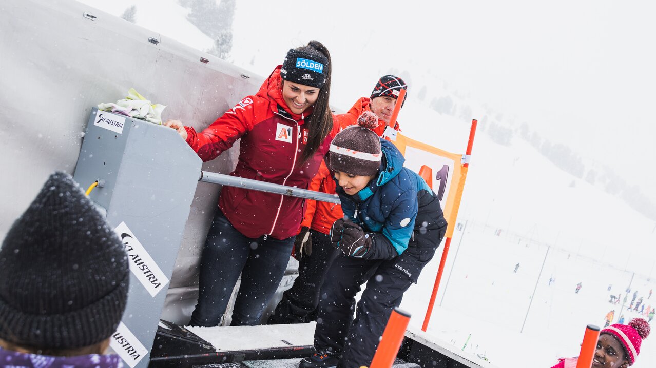 Pirstingerkogellift Sommeralm in Austria - a group of people that are standing in the snow.