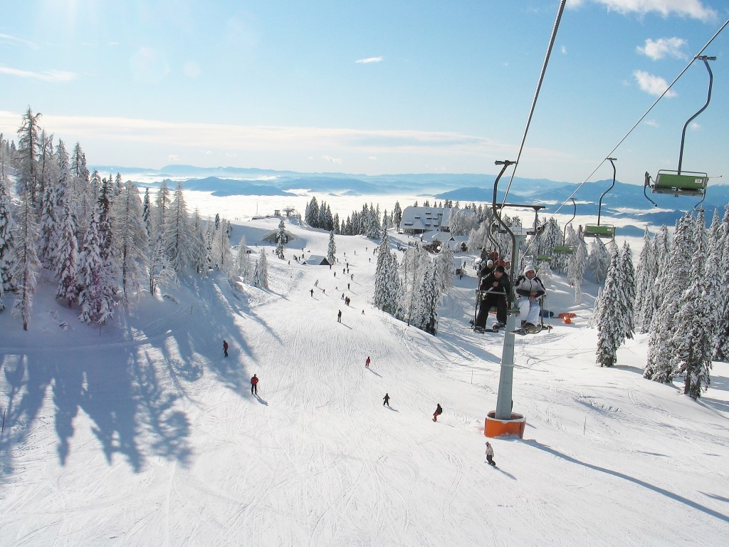 Celjska koča in Slovenia - a ski lift going down a snowy slope.
