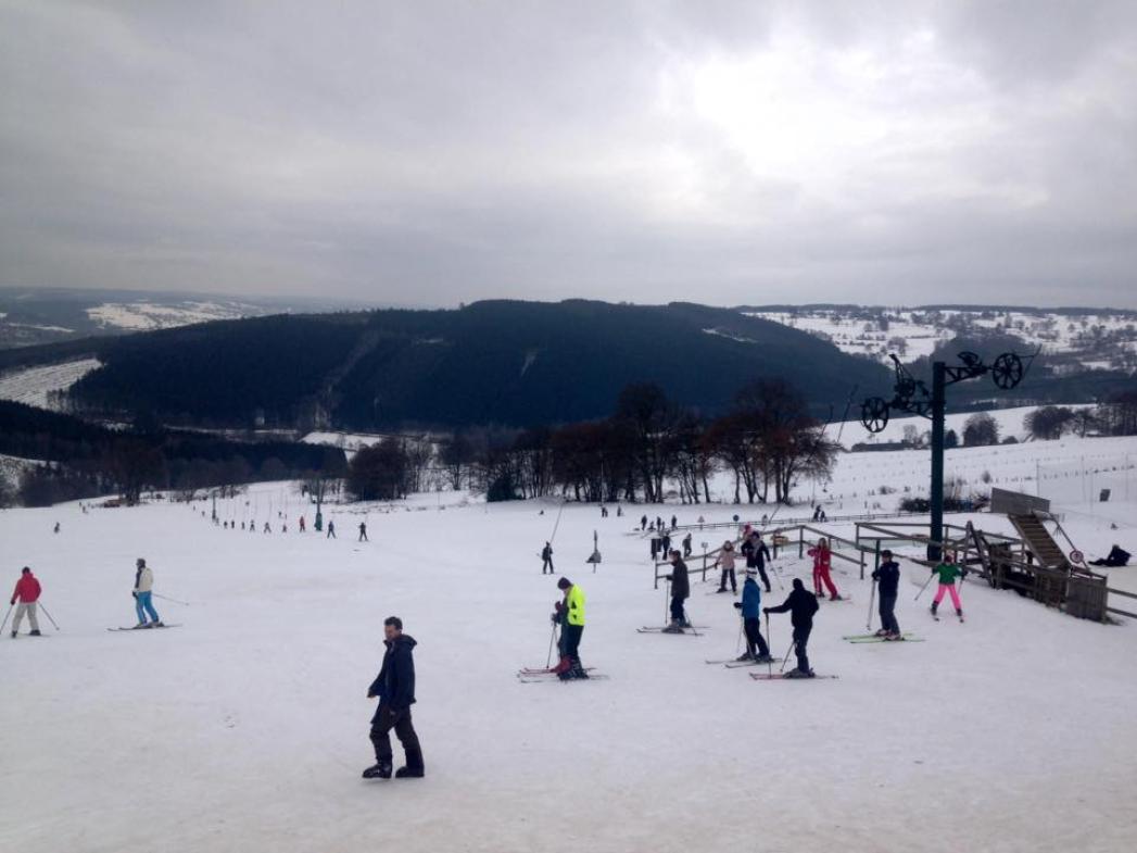 Val de Wanne in Belgium - a group of people skiing on a snowy slope.