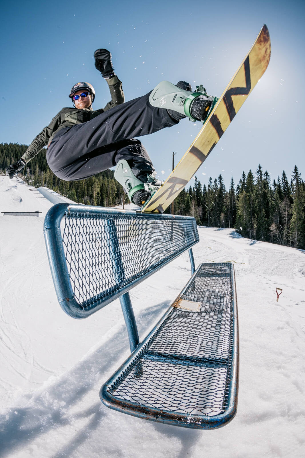 Mustavaara in Finland - a snowboarder doing a trick in the air.