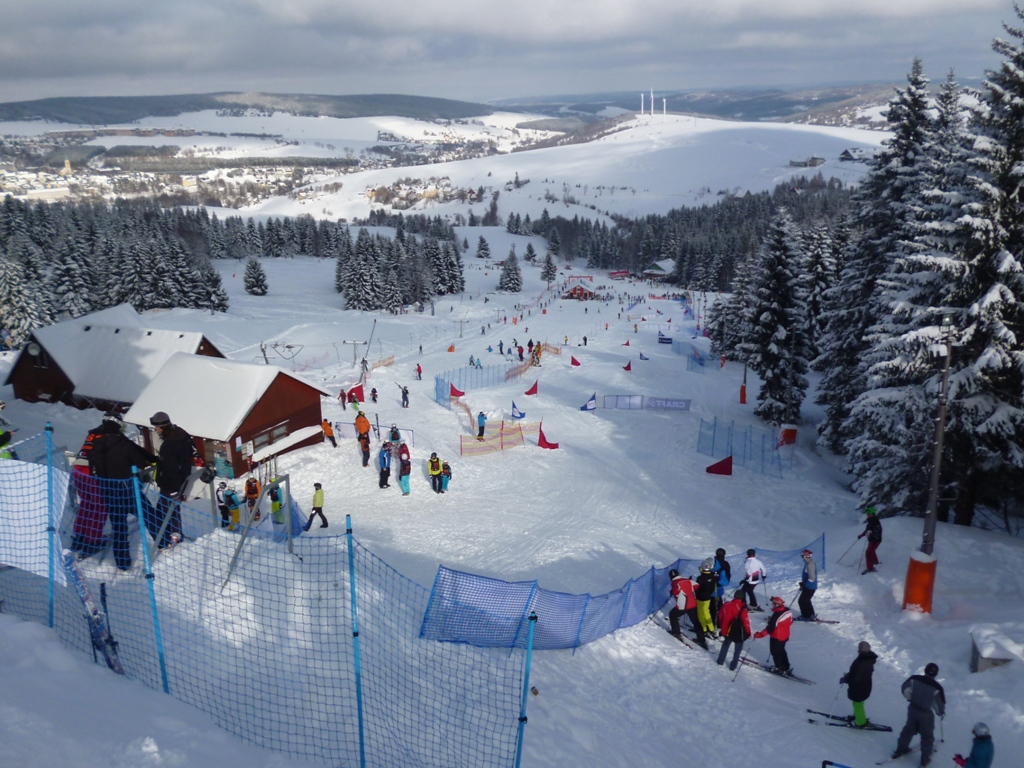Hlubočky in Czech Republic - a group of people skiing down a hill.