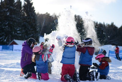Ekebyhovsbacken – Ekerö in Sweden - a group of children playing in the snow.
