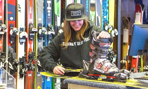 Ekebyhovsbacken – Ekerö in Sweden - a woman is working on a snowboard in a shop.