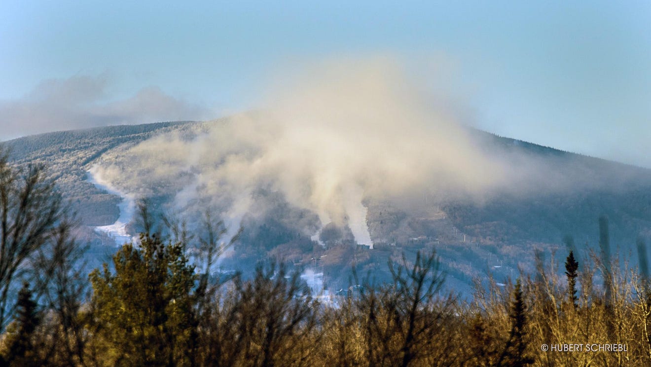 Stratton Mountain Resort in USA - a mountain covered in snow and clouds.