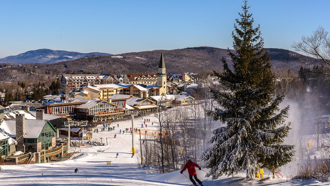 Stratton Mountain Resort in USA - a person skiing down a hill in the snow.
