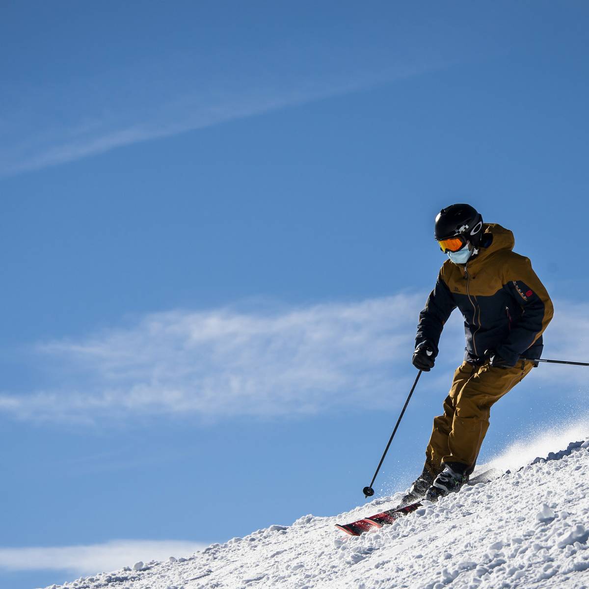 Schwarzer Mann – Prüm in Germany - a man in a yellow jacket skiing down a hill.