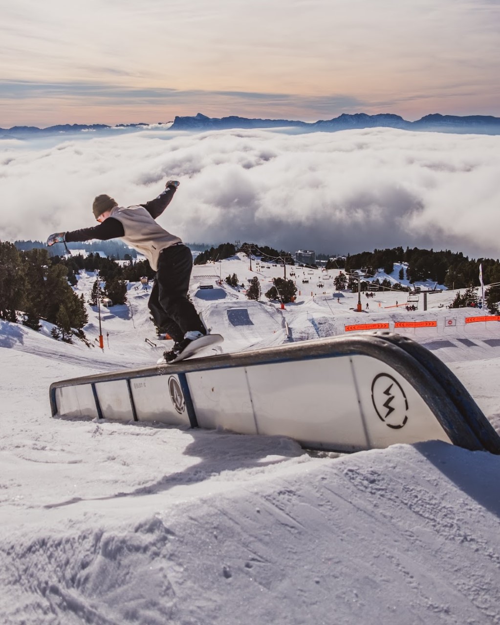 Chamrousse in France - a person on a snowboard at the top of a mountain.