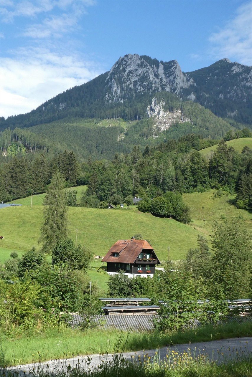 Kaiserau – Admont in Austria - a house in the middle of a green field.