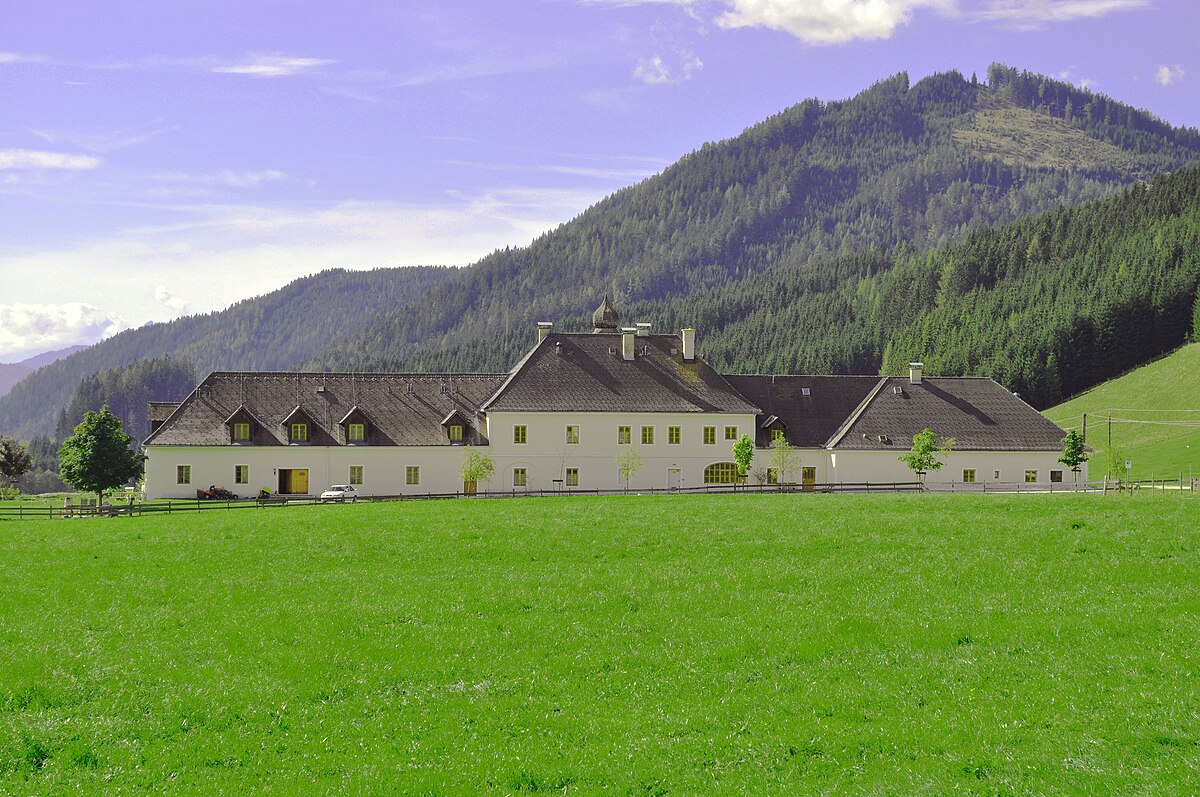 Kaiserau – Admont in Austria - a house in the middle of a green field.