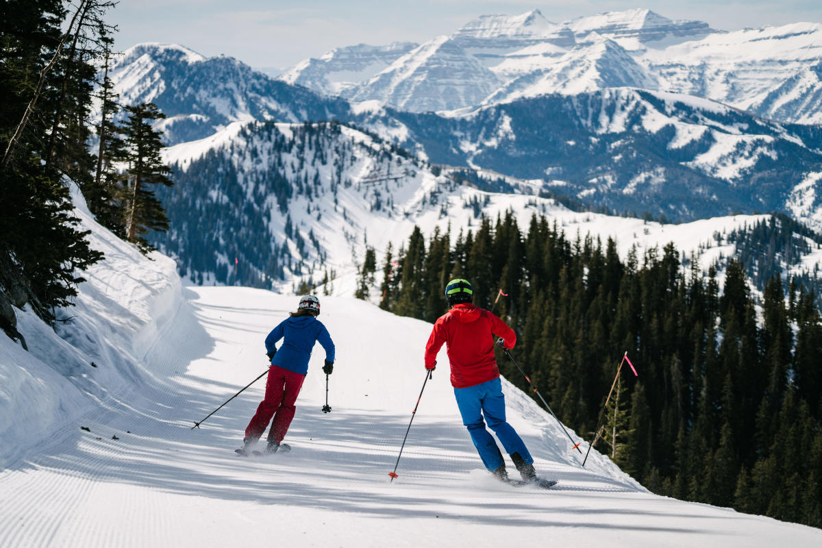 Lake City Ski Hill in USA - a couple of people skiing down a mountain.