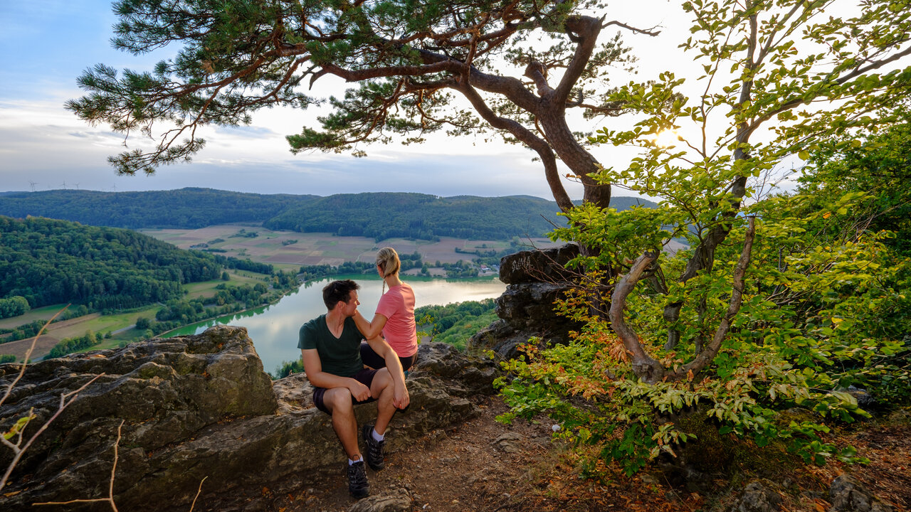 Brennberglift – Etzelwang in Germany - a man and woman sitting on top of a mountain.