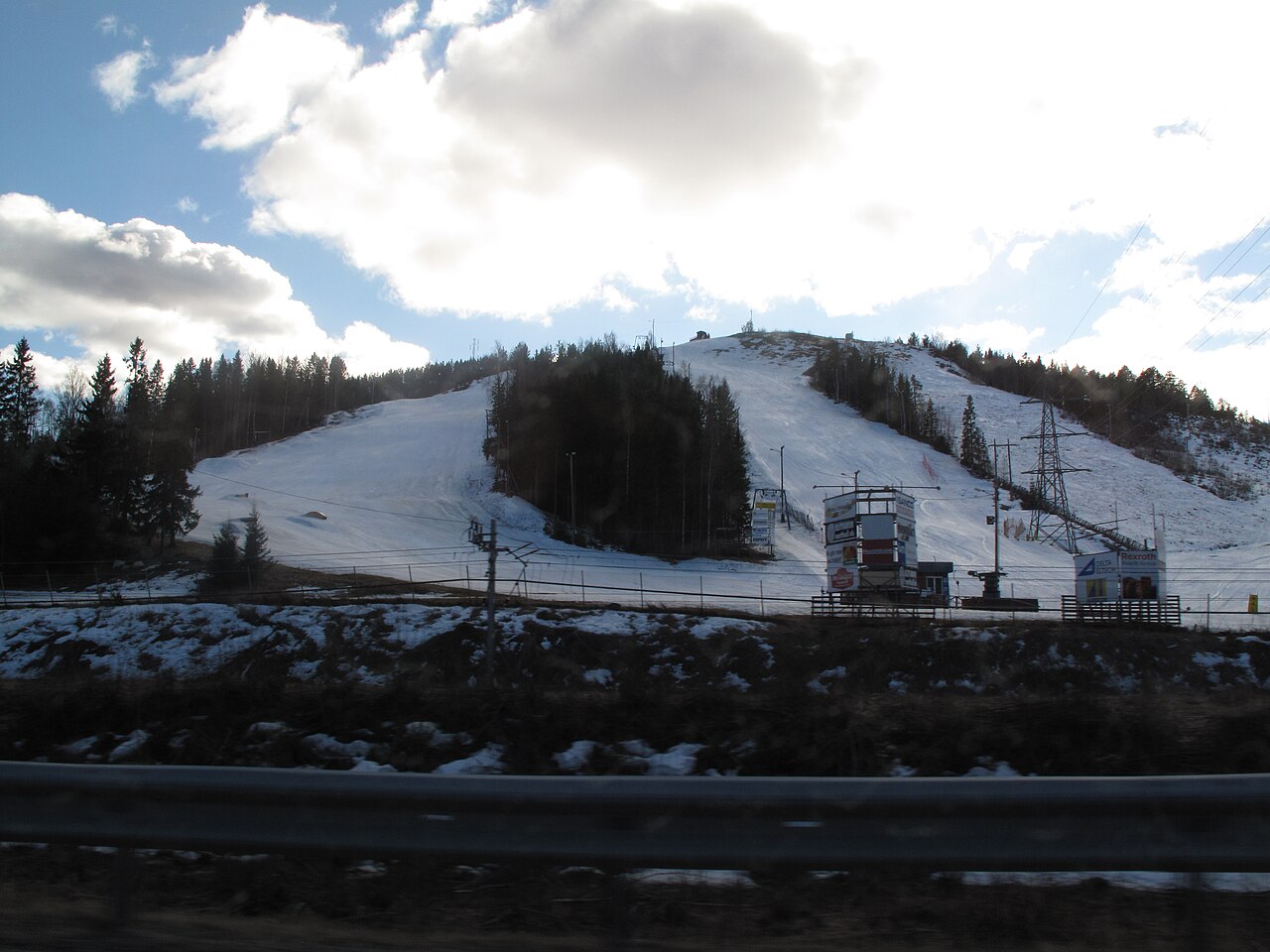 Åsbacken – Örnsköldsvik in Sweden - a snow covered mountain with a ski lift.