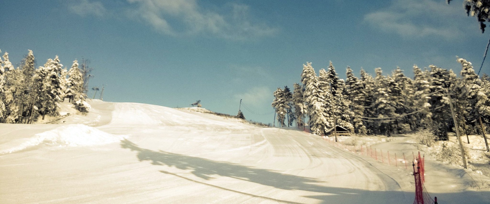 Mielakka in Finland - a person riding a snowboard down a snowy slope.