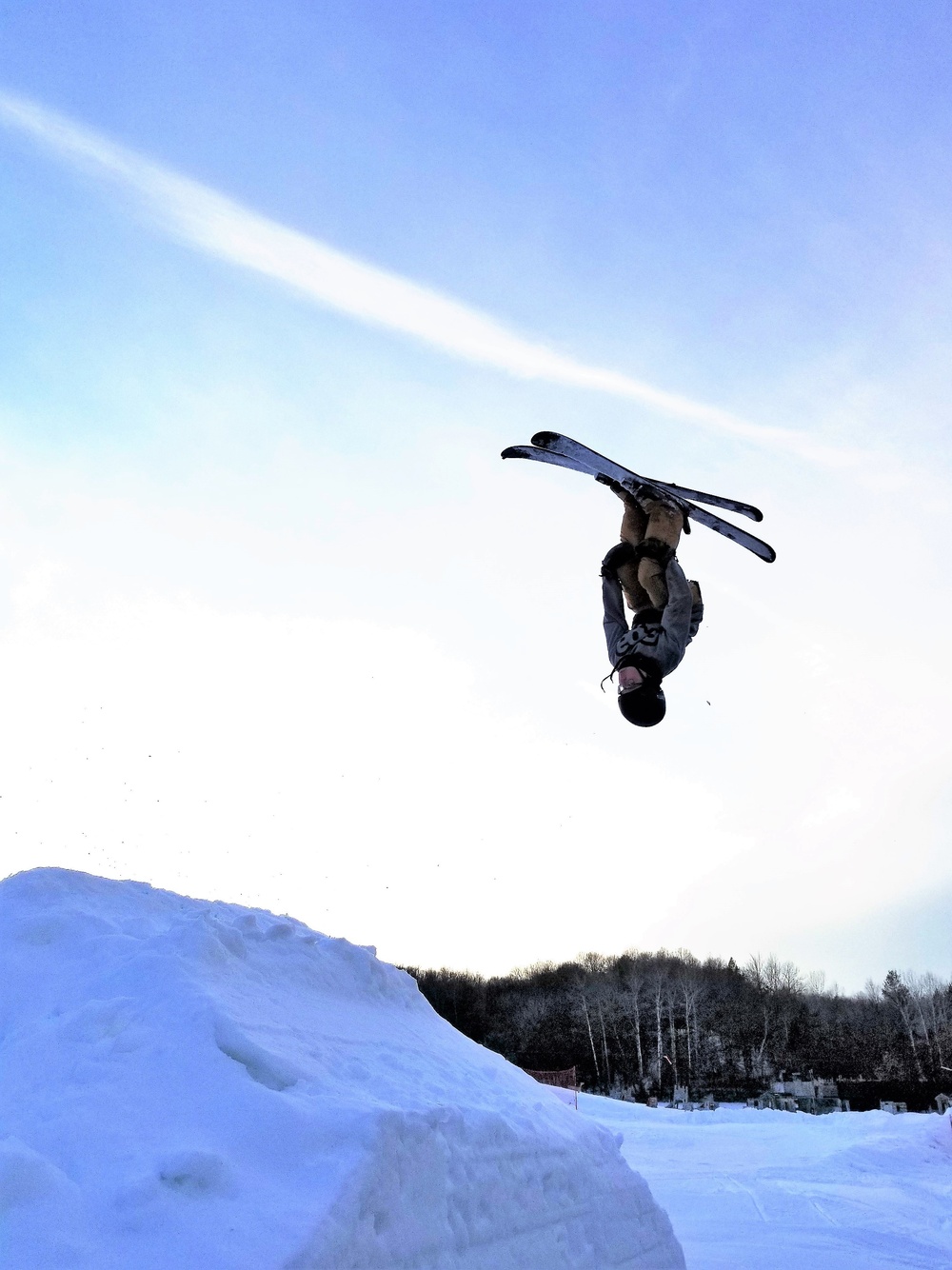Whitetail Ridge – Fort McCoy in USA - a man flying through the air while riding a snowboard.
