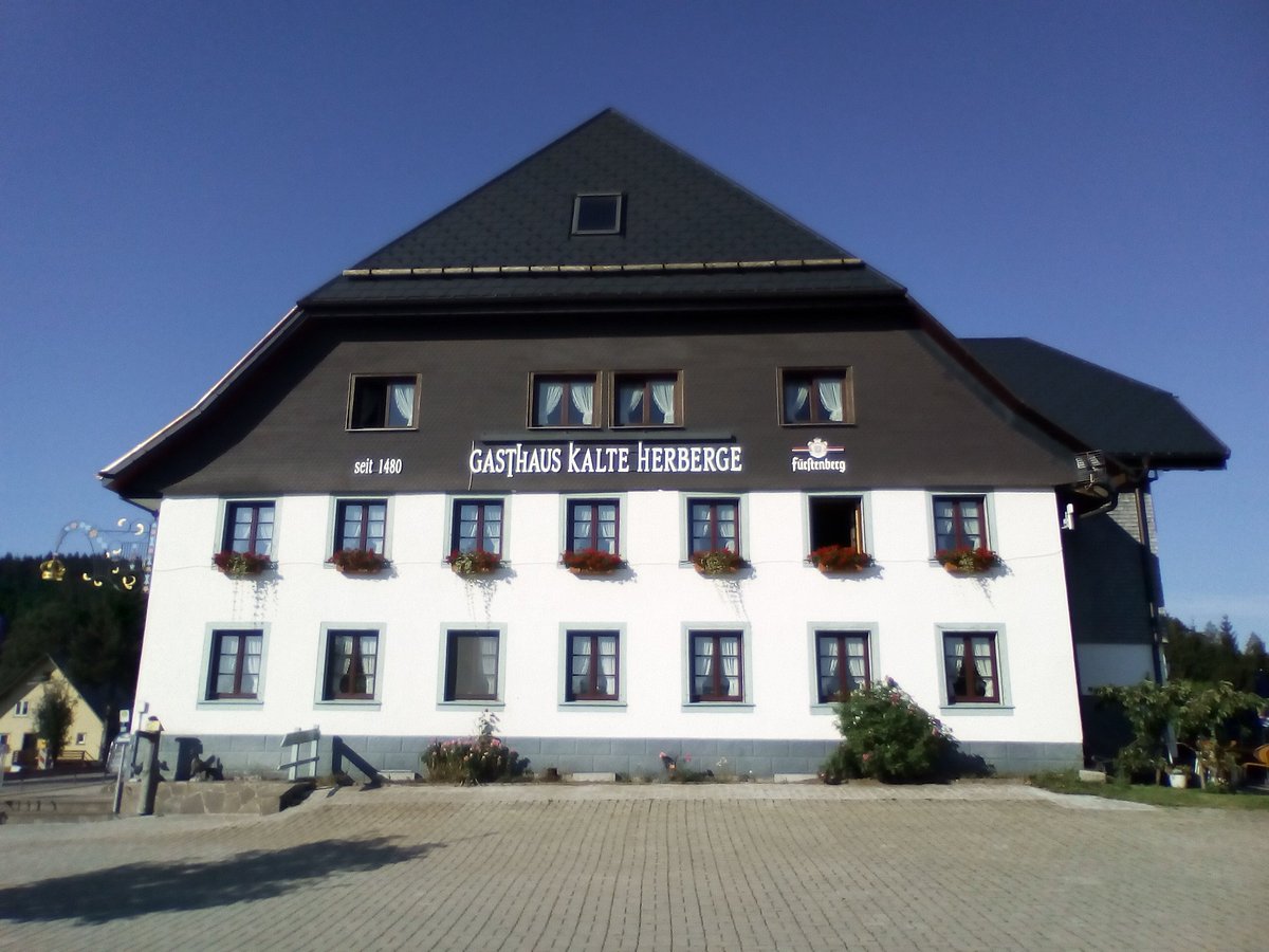 Kalte Herberge – Urach in Germany: a white building with a black roof and windows.