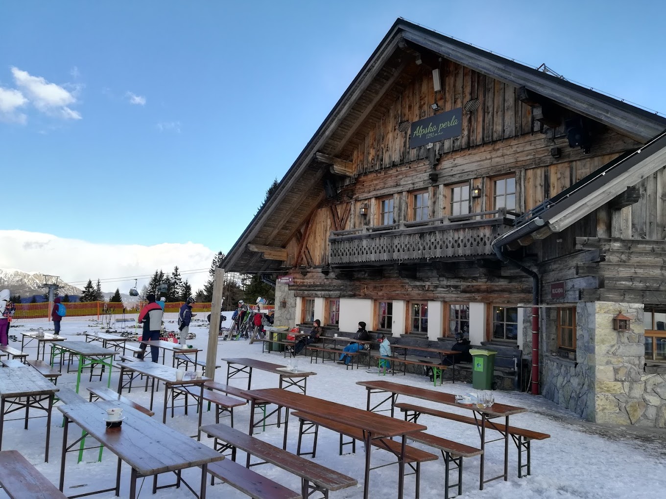 Brunni – Alpthal in Switzerland: a group of people standing in front of a building.