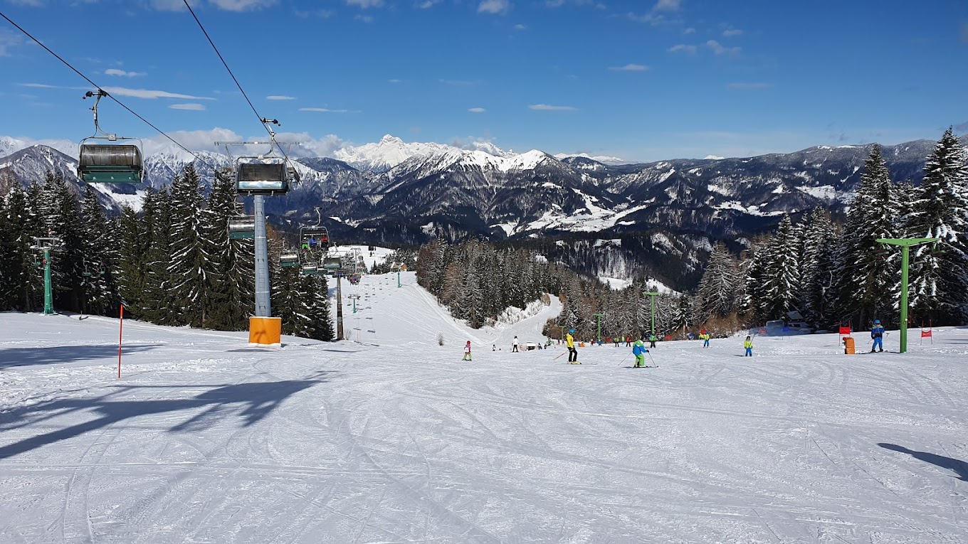 Brunni – Alpthal in Switzerland - a ski slope with people skiing down it.