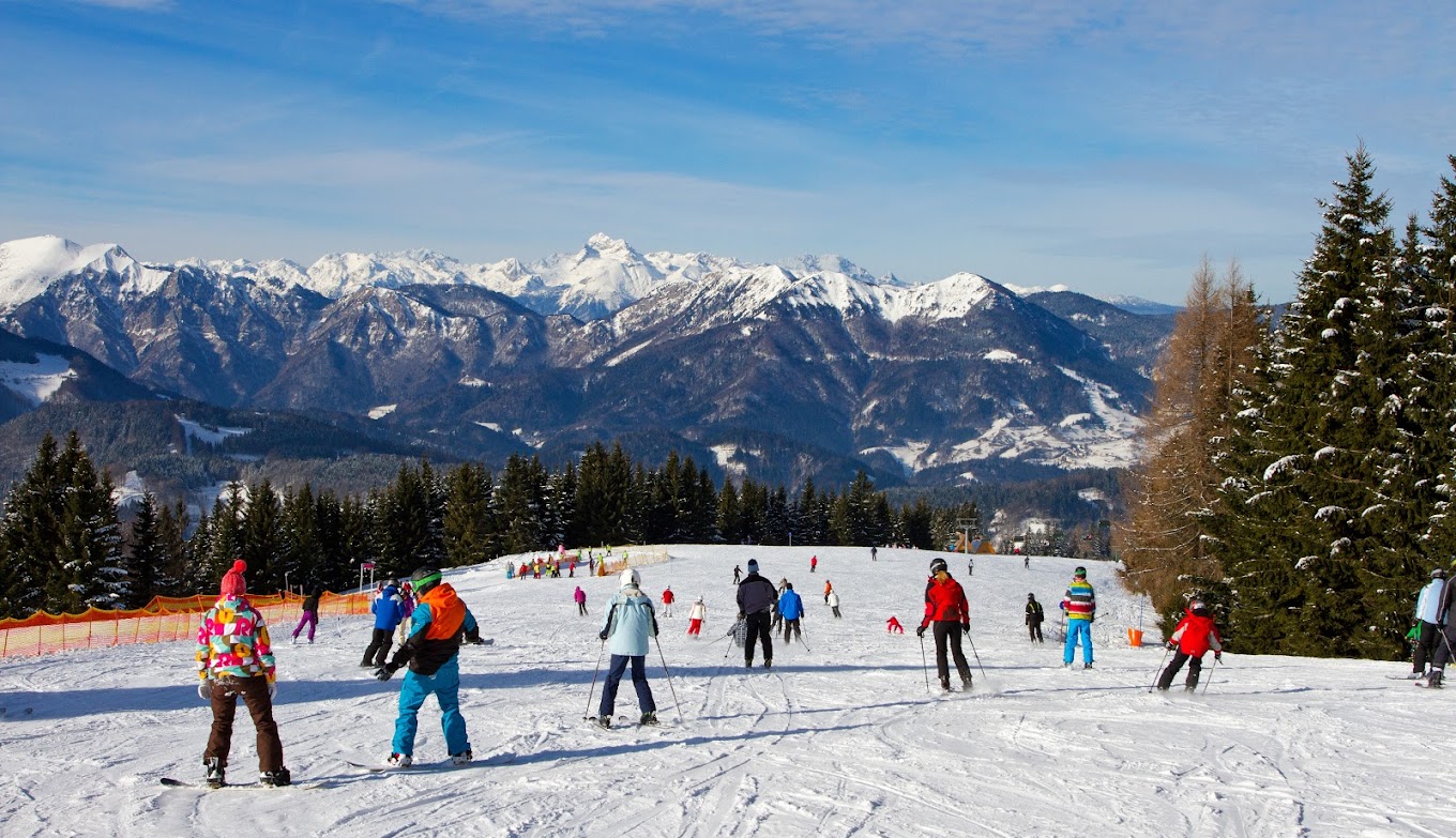 Brunni – Alpthal in Switzerland - a group of people skiing down a snowy slope.