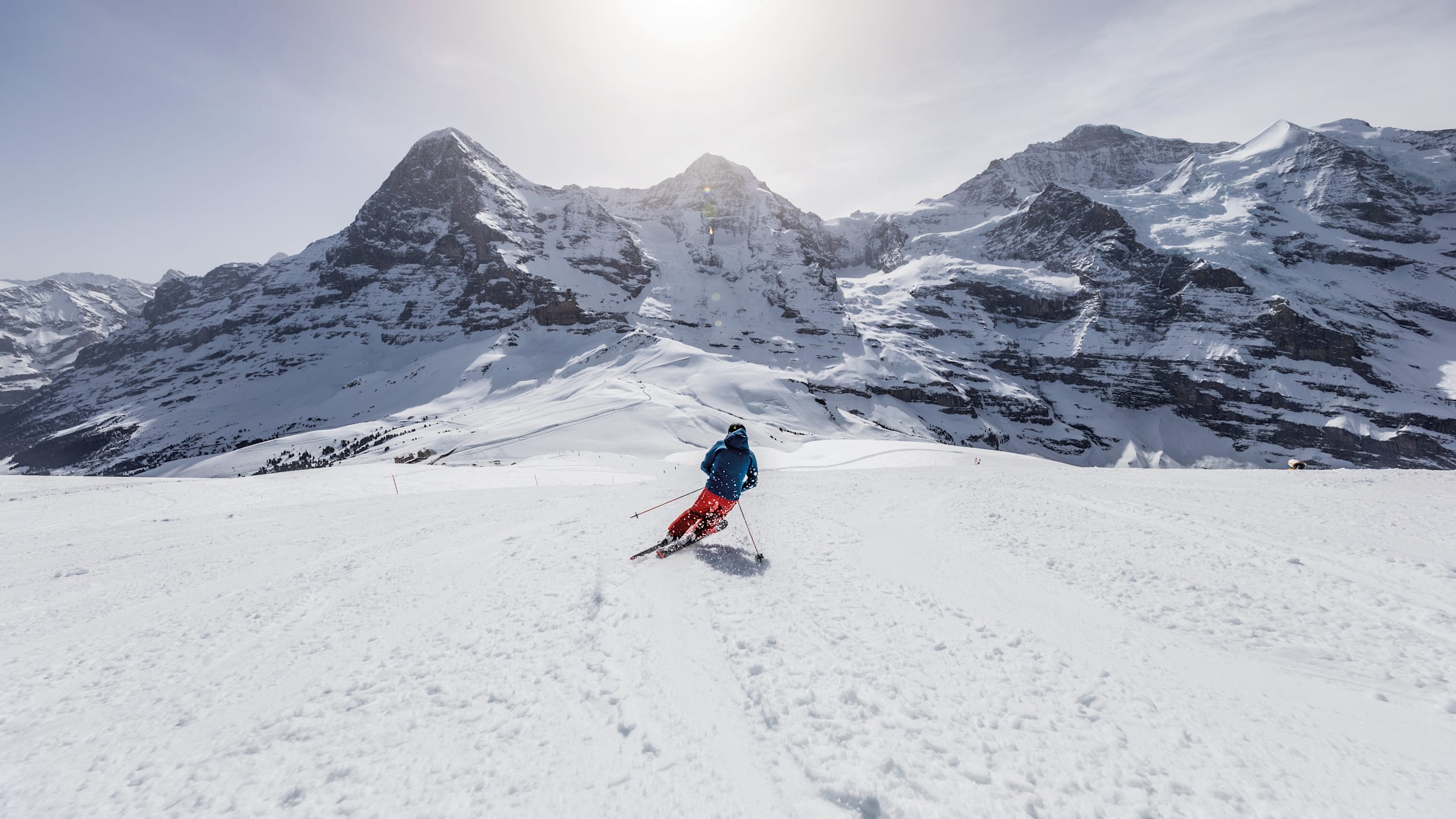 Wengen in Germany - a person skiing down a snowy slope in the mountains.
