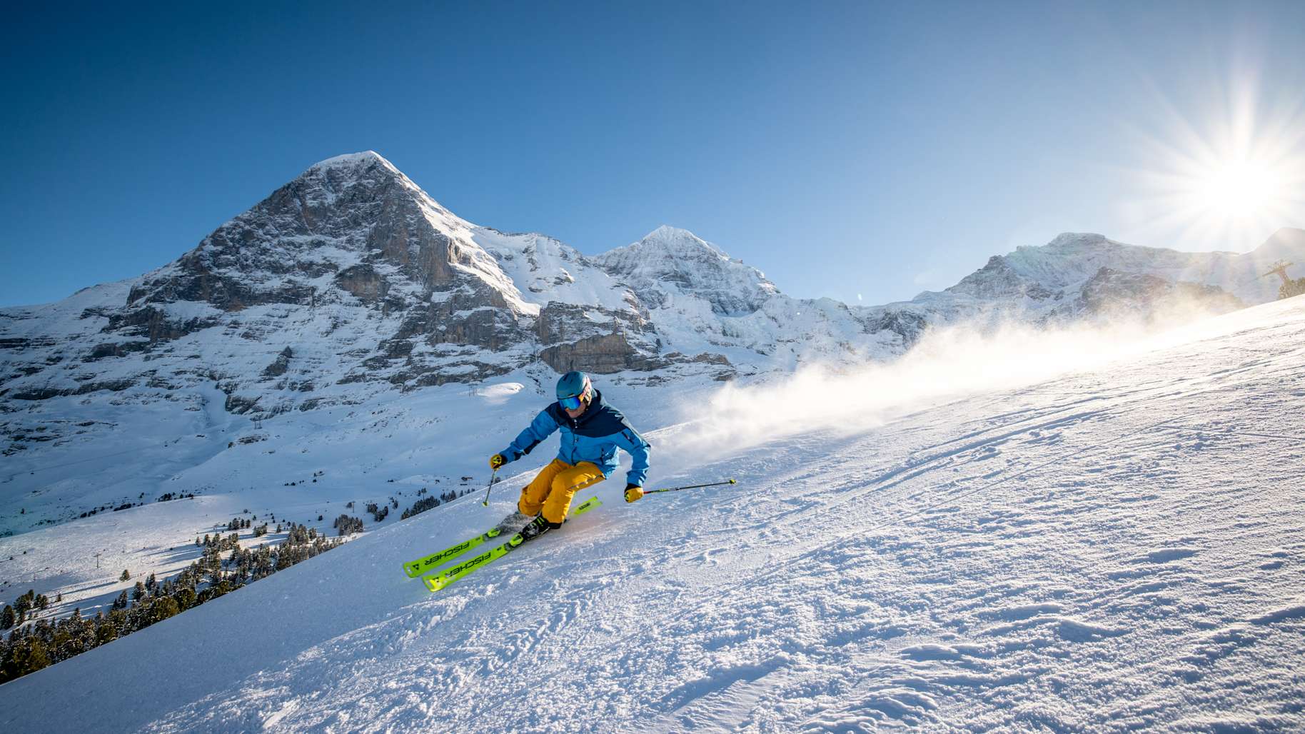 Wengen in Germany - a person on a snowboard going down a hill.