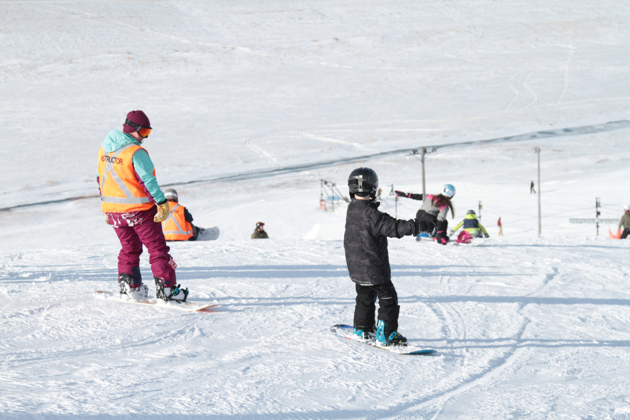 Spring Hill Winter Park in Canada - a child on a snowboard.