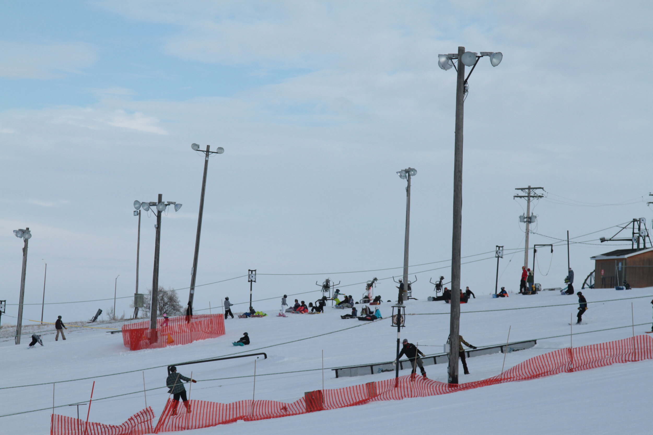 Spring Hill Winter Park in Canada - a group of people skiing down a hill.