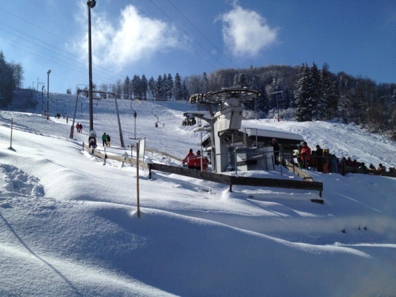 Schlossberg – Albstadt-Tailfingen in Germany - a snow covered ski slope with people on it.
