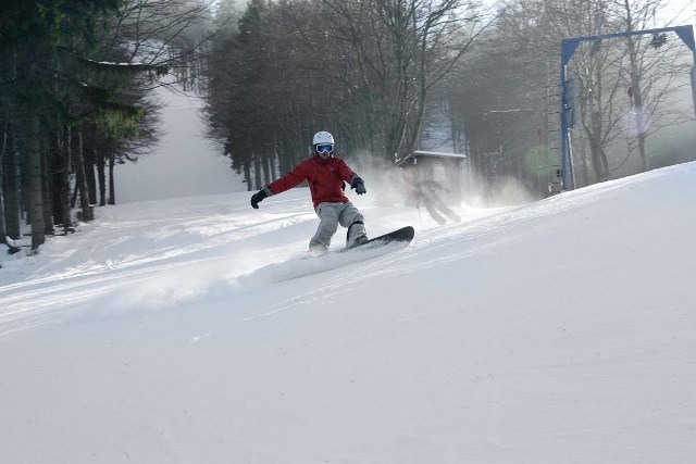 Salzberg – Goldlauter in Germany - a person on a snowboard going down a hill.