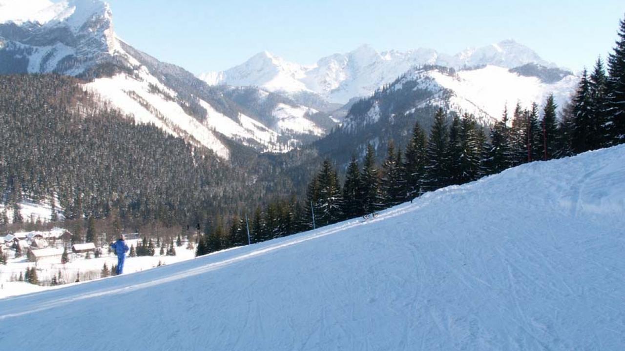 Ski TaJa – Tatranská Javorina in Slovakia - a person skiing down a snowy slope in the mountains.