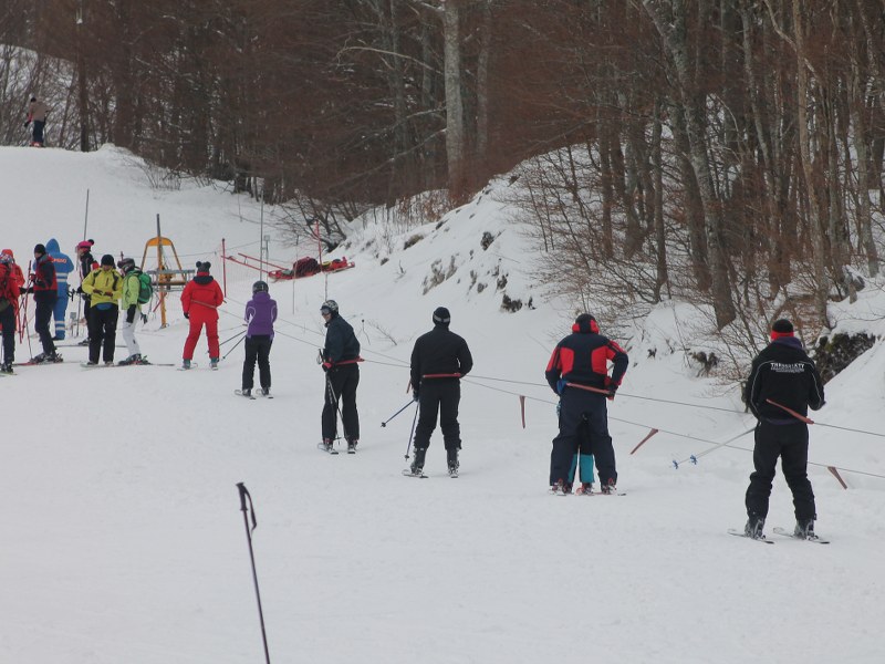 Velebno in Croatia - a group of people skiing down a hill.