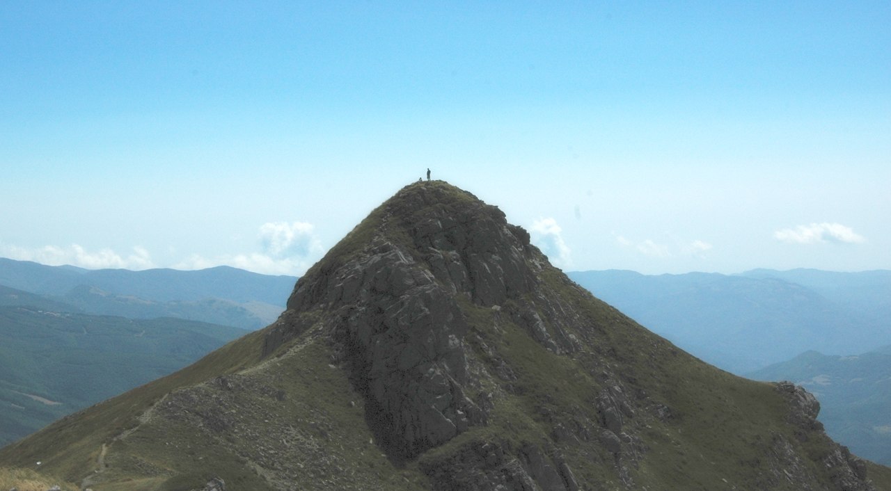 Fiumalbo – Doccia in Italy - a person standing on top of a mountain.