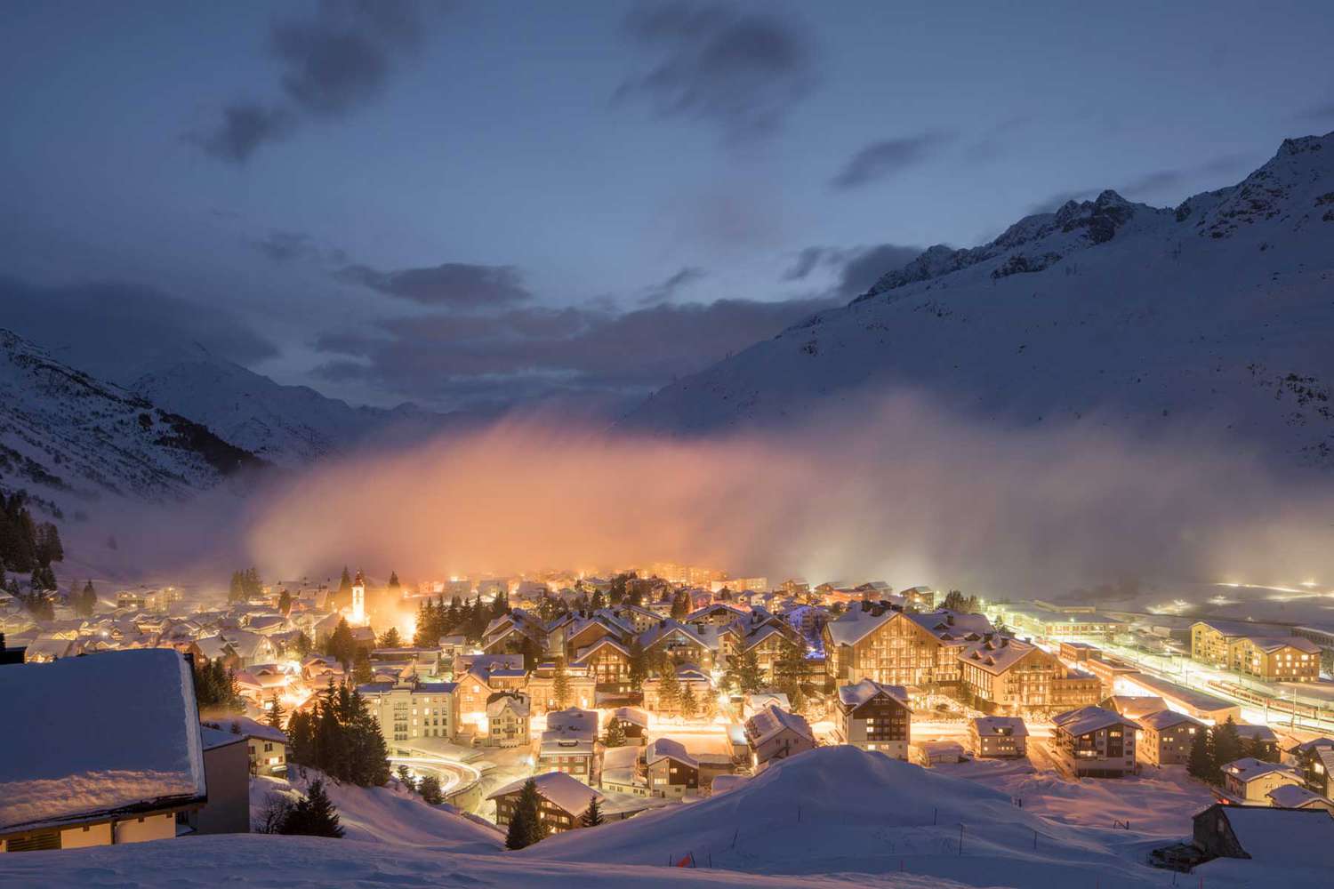 Gemsstock – Andermatt in Switzerland - a town in the mountains at night.