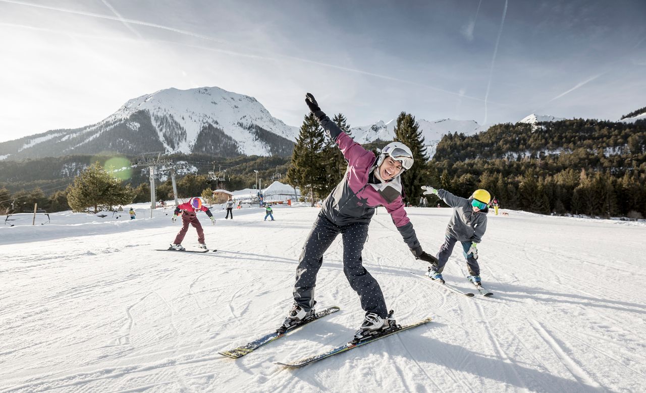 Hoch-Imst – Imst in Austria - a group of people riding ski boards on a snowy slope.