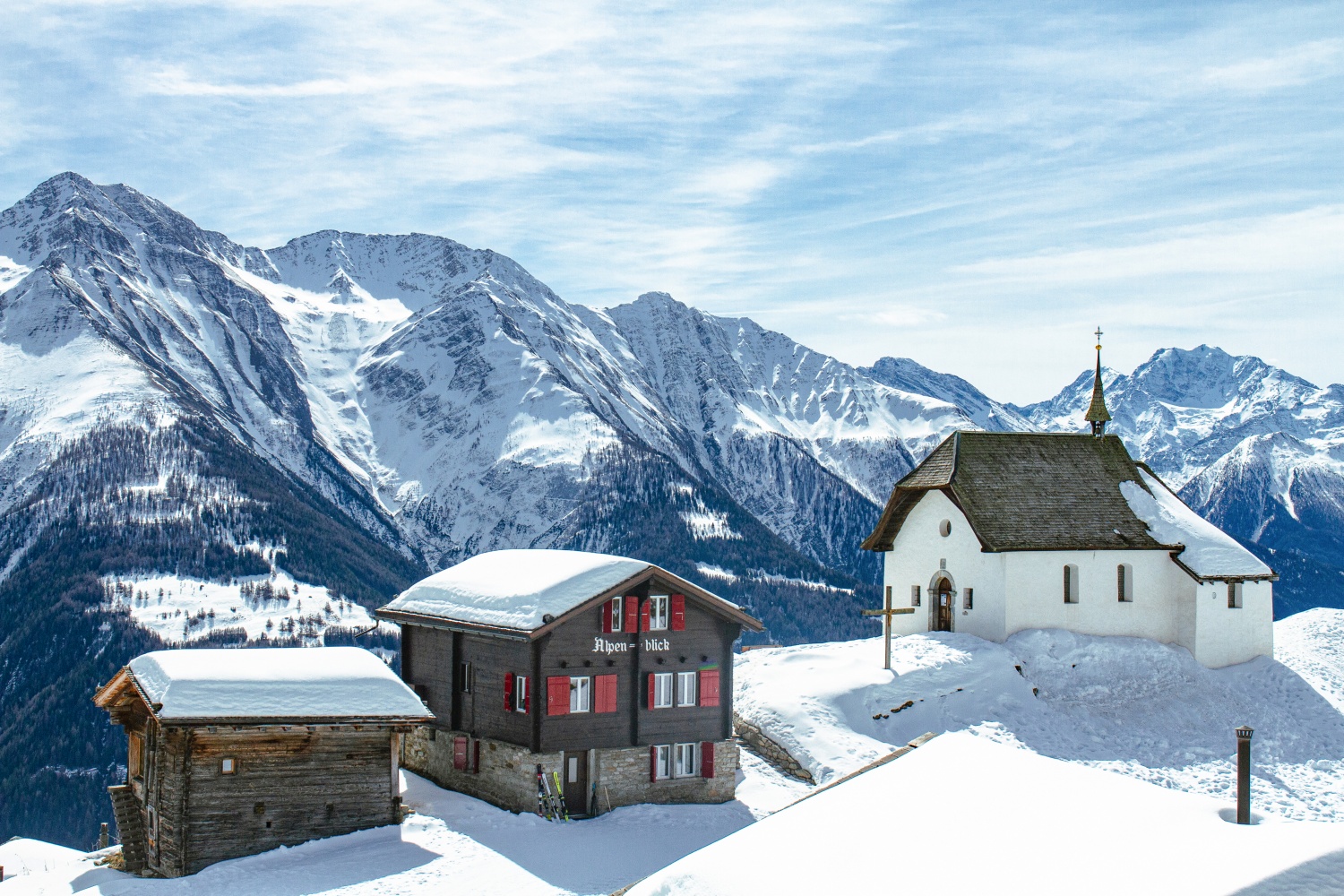 Aletsch Arena in Switzerland - a small house in the middle of a snowy mountain.