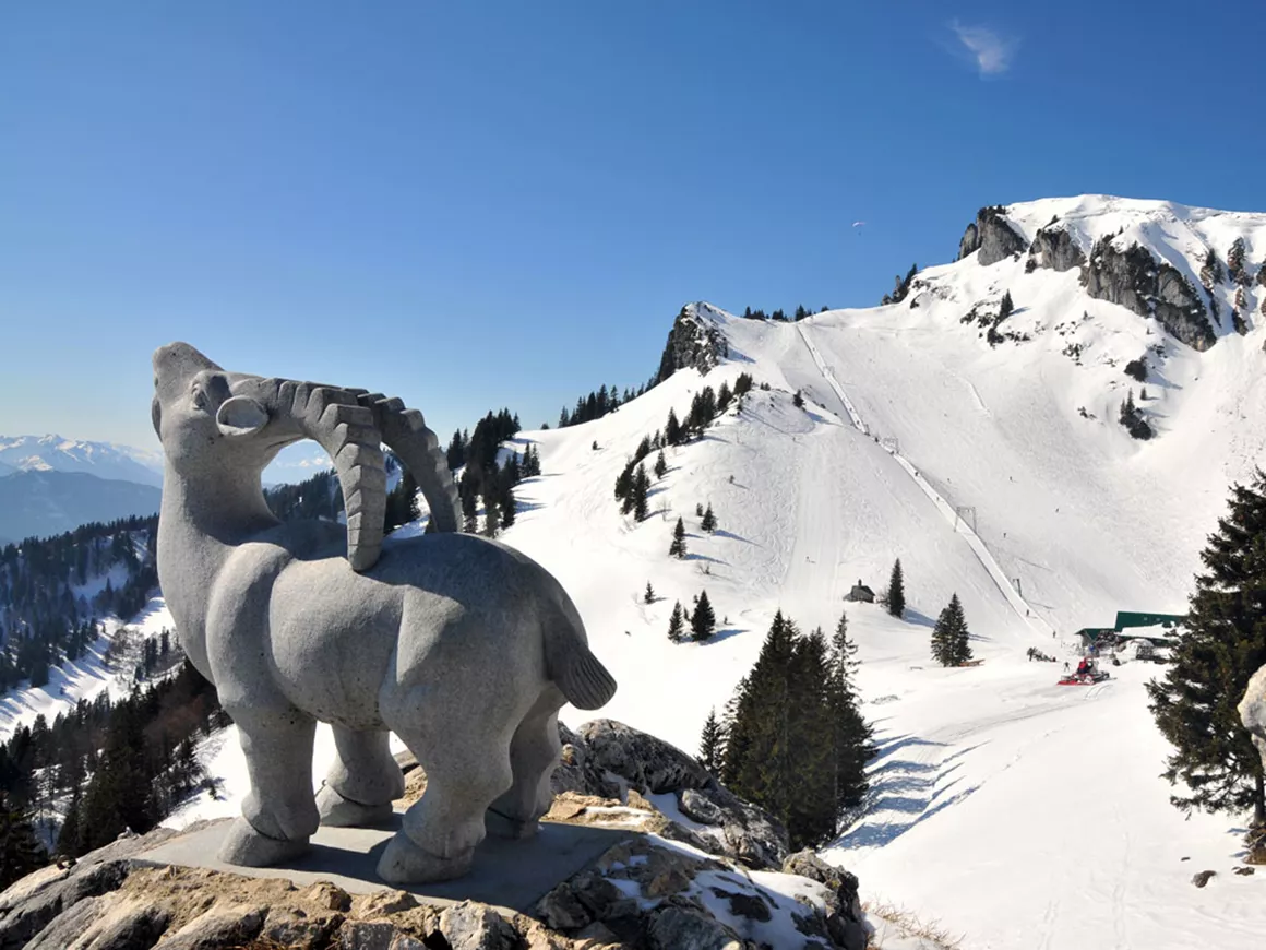 Brauneck – Lenggries | Wegscheid in Germany - a statue of a ram on top of a mountain.