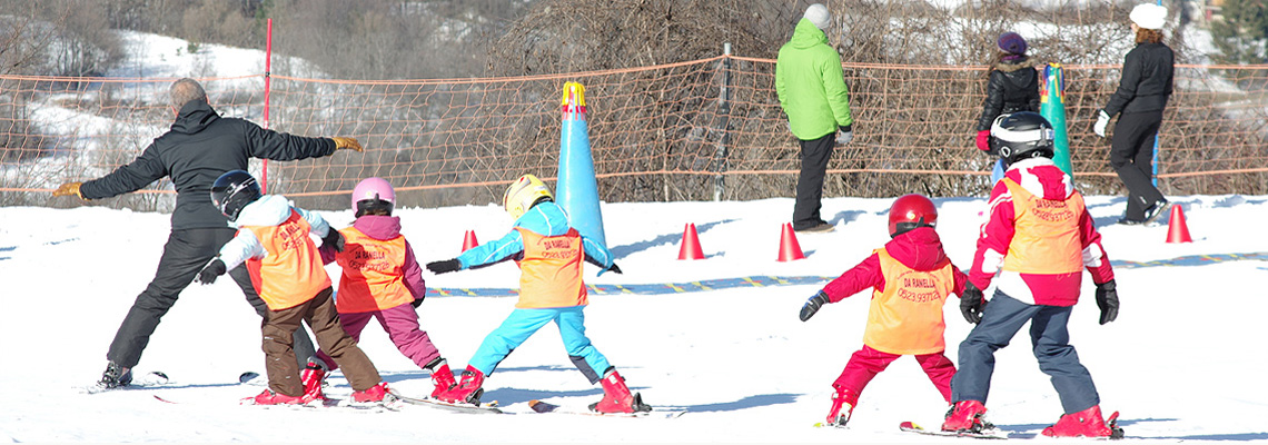 Passo Penice in Italy - a group of kids playing in the snow.