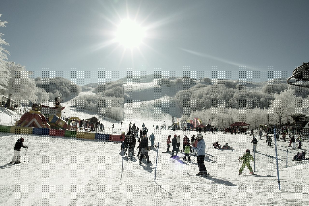 Passo Penice in Italy - a group of people skiing down a snowy slope.