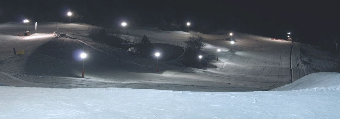 Passo Penice in Italy - a person on a snowboard doing a trick.