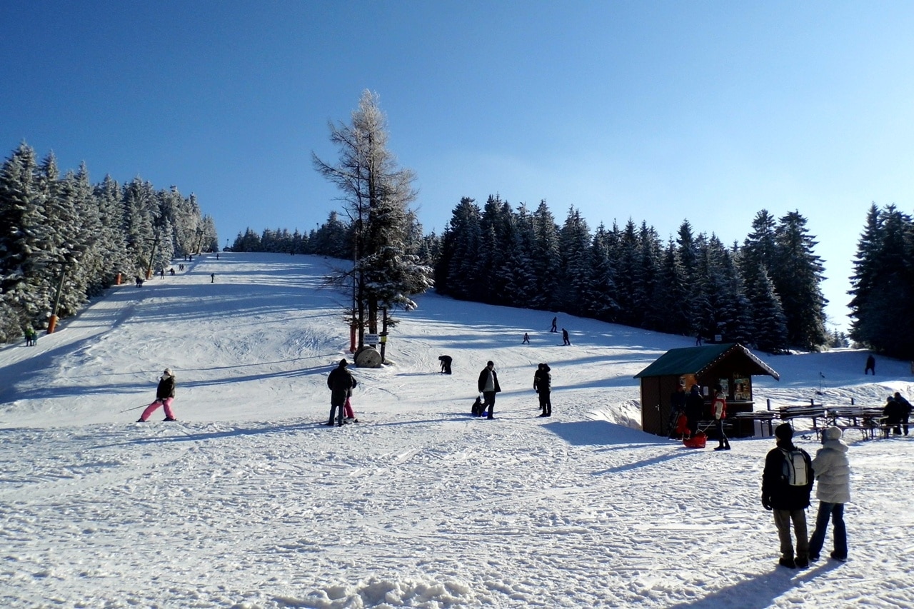 Unterstmatt in Germany - a group of people skiing down a snowy hill.