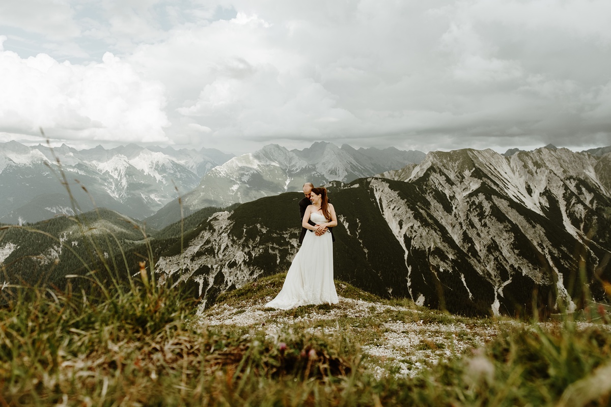 Rosshütte – Seefeld in Austria - a bride standing on top of a mountain.