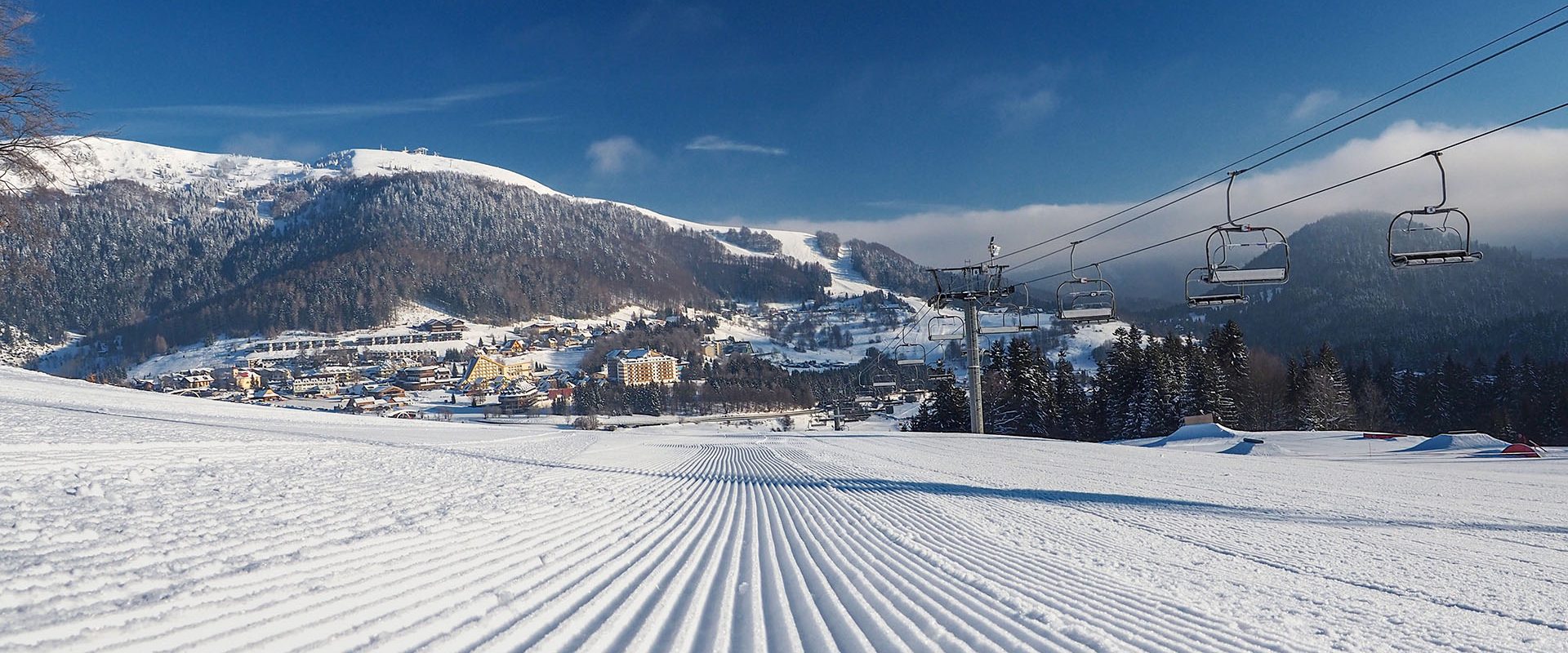 Selce Čachovo in Slovakia - a ski slope with a ski lift in the background.