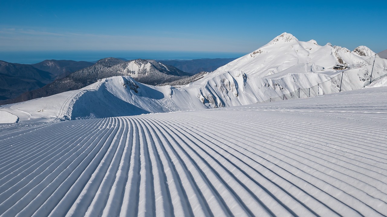Rosa Khutor in Russia - a view from the top of a snowy mountain.