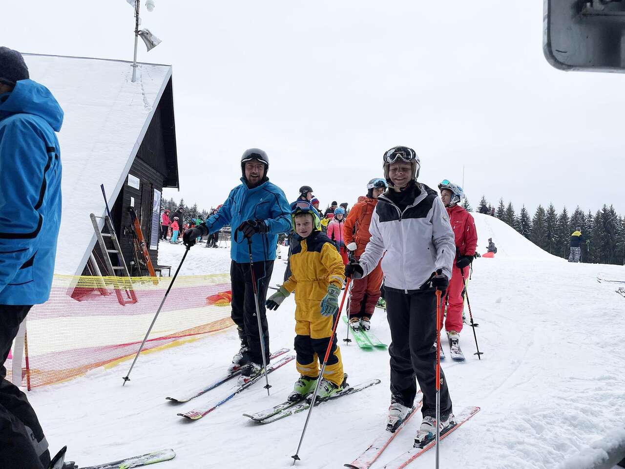 Hlobišov – Hronec in Slovakia - a group of people riding ski boards down a slope.