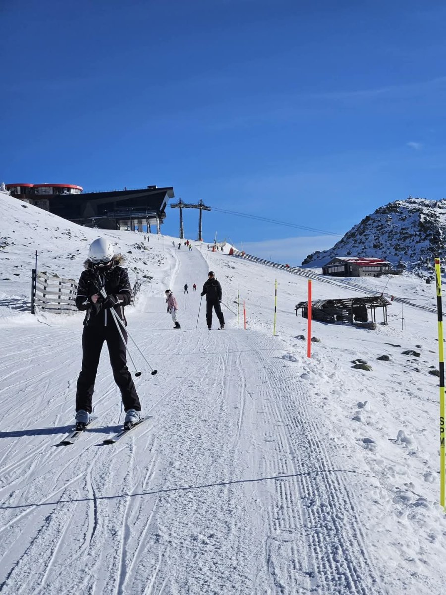Hlobišov – Hronec in Slovakia - a group of people skiing down a snow covered slope.