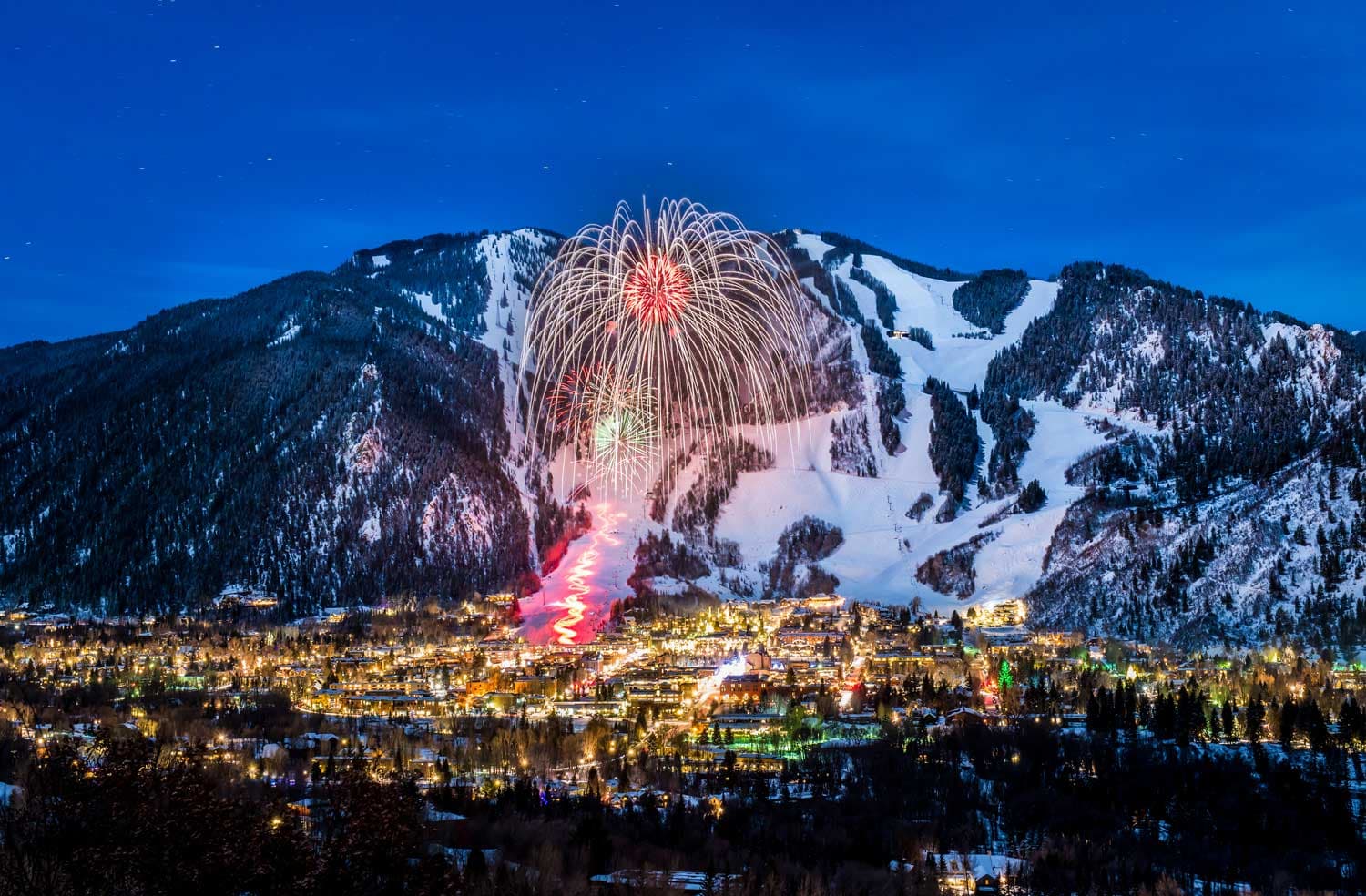 Aspen Mountain Snowmass, USA, picturesque village at night with fireworks