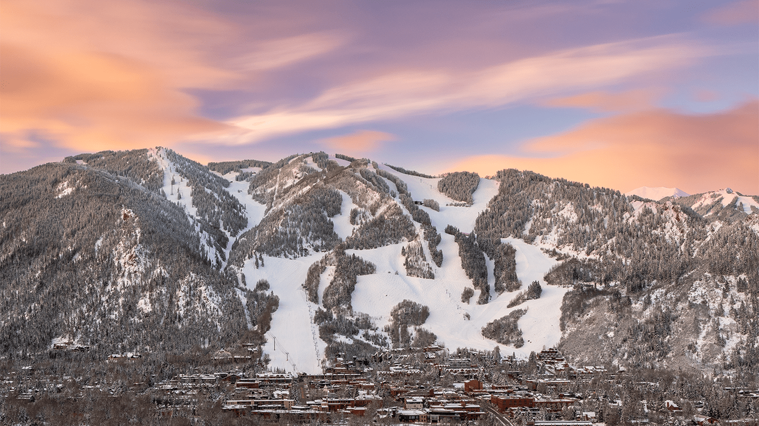 Aspen Mountain in USA: a view of a ski resort with a mountain in the background.